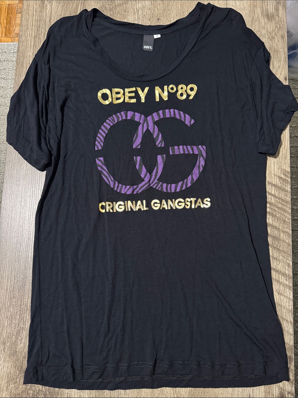 Obey Black Tee with Purple Zebra Logo and Gold Lettering